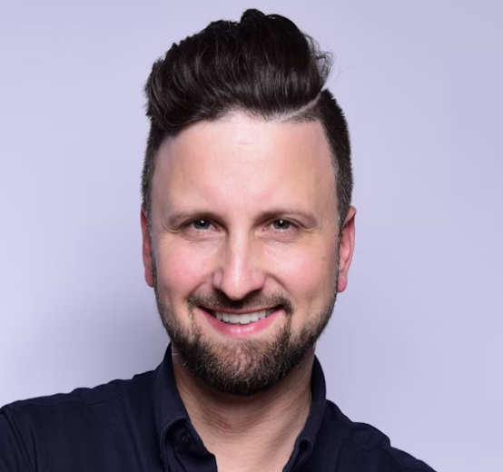 Smiling man with short hair